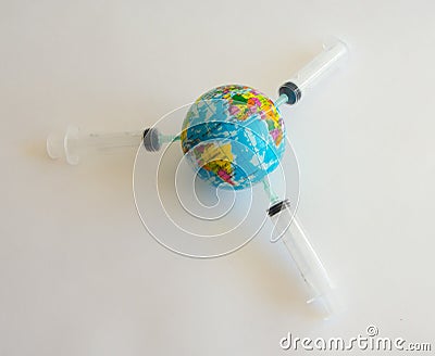 Model planet earth on syringes on white background - image Stock Photo
