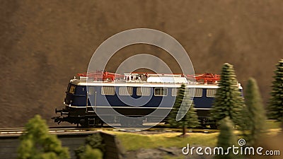 Model of railway diesel locomotive moving on railroad. Stock Photo