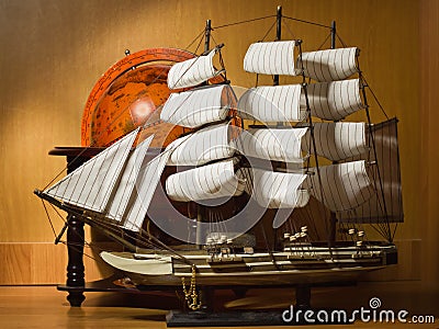 Model sailing ship and old globe Stock Photo