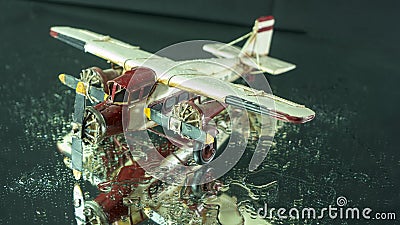 Model tin plane on black ground Stock Photo