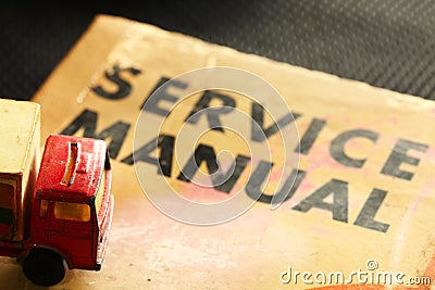 Model vehicle scene put on the old service book. Stock Photo