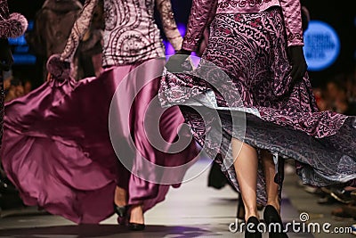 Model walk the runway at Fashion Show. Legs of model on catwalk runway show event Stock Photo