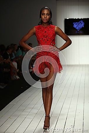 A model walks runway in designer swim apparel during the Furne Amato fashion show Editorial Stock Photo