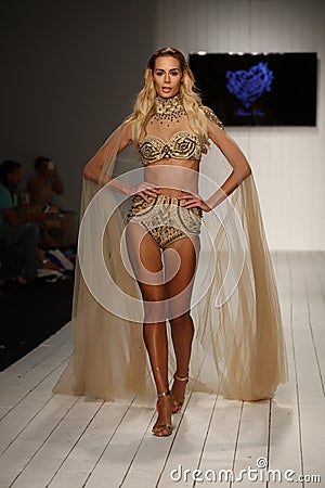 A model walks runway in designer swim apparel during the Furne Amato fashion show Editorial Stock Photo