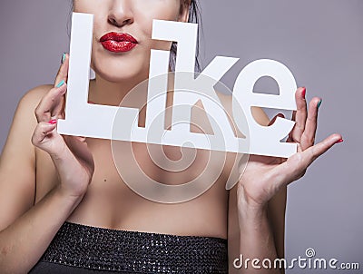 Model woman with red lips with white letters LIKE Stock Photo