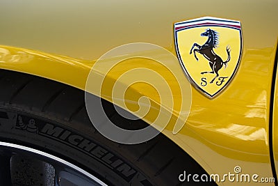01-07-2021, Modena - Italy. Ferrari logo and Michelin tire on sport car during Motor Valley Exibition 2021 Editorial Stock Photo