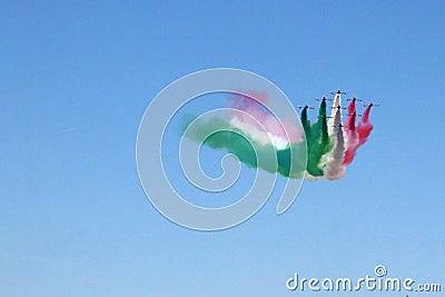 Frecce Tricolore, acrobatic air force patrol of the Italian air force, evolutions with Italian tricolor smoke trails Editorial Stock Photo