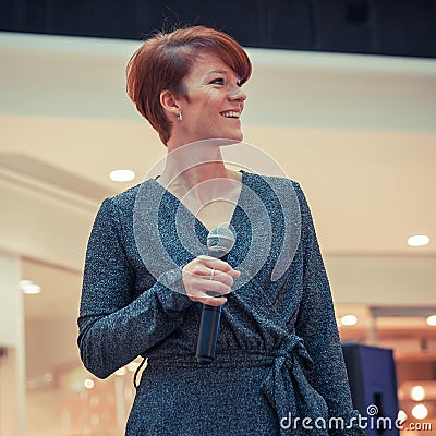 Moderator of fashion shows at the business center Stock Photo