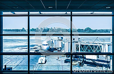 Modern airport with airplane at the terminal gate Stock Photo