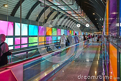 Modern airport moving walkway indoor with travelers. Transport corridor Editorial Stock Photo