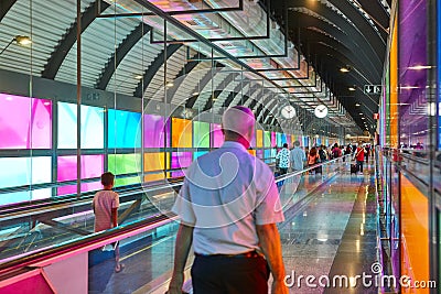 Modern airport moving walkway indoor with travelers. Transport corridor Editorial Stock Photo