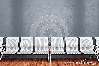 Modern airport waiting room with blank concrete wall Stock Photo