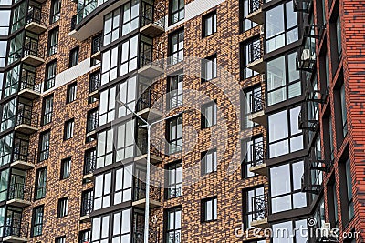 Modern apartment building. Facade of a modern apartment building. Modern residential building with new windows and styli Stock Photo