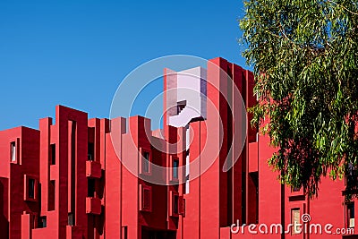 The modern apartment complex `La Muralla Roja` by architect Ricardo Bofill in Calpe, Spain Editorial Stock Photo