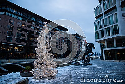 Modern architecture of the city of Oslo Norway during the winter with Christmas decoration in the snow-covered center Editorial Stock Photo