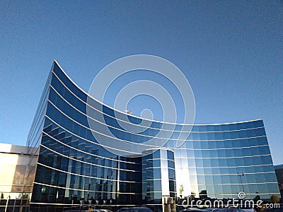 Modern architecture with curved geometry and dark glass facade with aluminium boarders Editorial Stock Photo