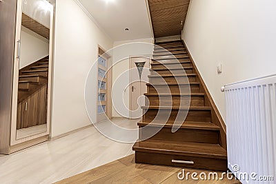 Modern architecture interior with elegant luxury hallway with glossy wooden staps stairs in modern storey house Stock Photo