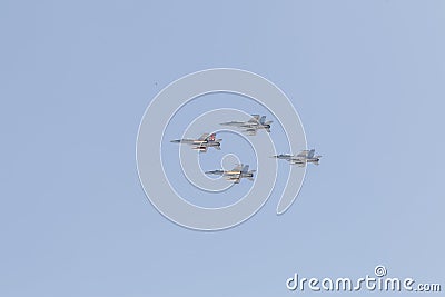 Modern armed military fighter jets flys in formation through the sky Stock Photo