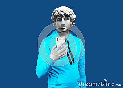 Modern art collage. Concept portrait of a man holding mobile smartphone using app texting sms message. Gypsum head of Antinous. Stock Photo