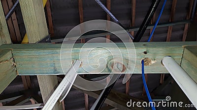 Modern Australian brick veneer construction internal timber wall and roof frame with electrical wiring Stock Photo