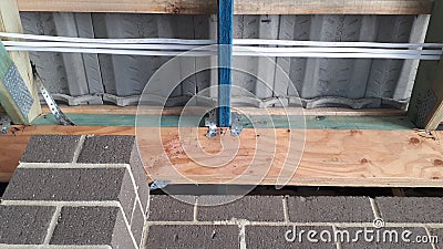 Modern Australian brick veneer construction internal timber wall and roof frame with electrical wiring Stock Photo