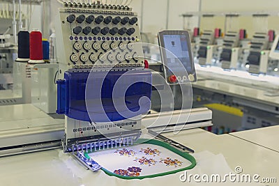 Modern and automatic high technology sewing machine for textile or clothing apparel making manufacturing process Stock Photo