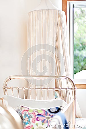 Modern baby bedroom with a Mosquito net and duvet Stock Photo