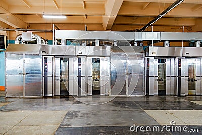 Modern bakery in confectionery factory. Industrial ovens for baking biscuits, cakes and cookies Stock Photo