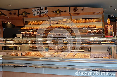 Modern bakery with different kinds of bread, cakes and buns Stock Photo