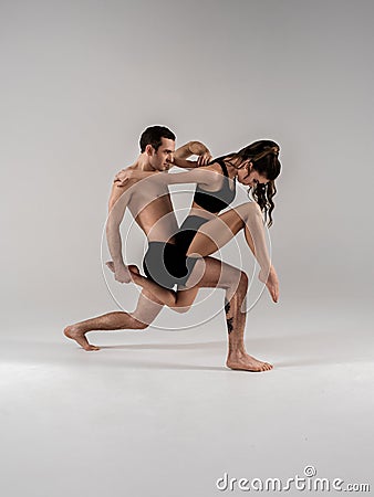 Modern ballet dancer couple in black form performing art element with empty copy space background, izolated Stock Photo