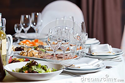 Modern banquet hall. Decorated tables, elegant setting, beautiful interior Stock Photo