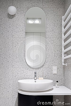 Modern bathroom with oval mirror Stock Photo