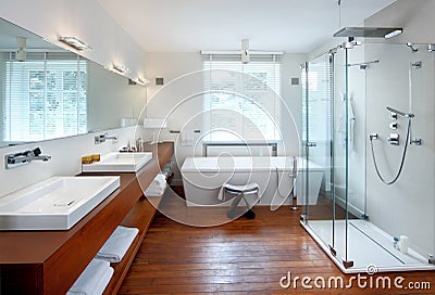 Modern Bathroom With Wooden Floor And Accents Stock Photo