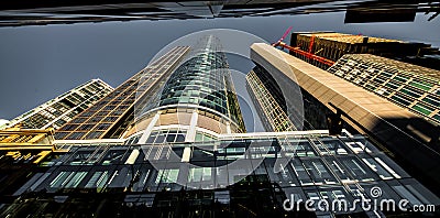 Modern beautiful new skyscraper in the bussines part of the city against the blue sky on a sunny day without people a wide viewing Editorial Stock Photo