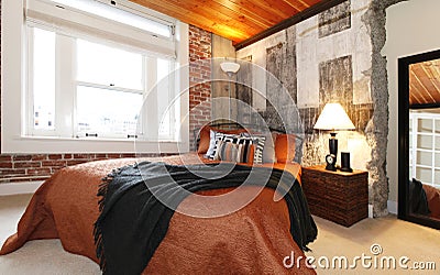 Modern bedroom with a broken concrete wall Stock Photo