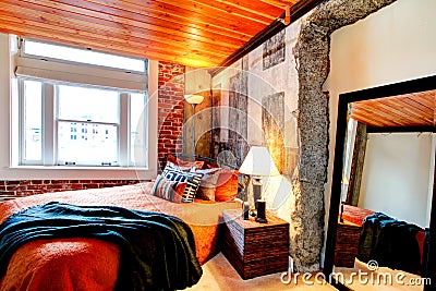 Modern bedroom with a broken concrete wall Stock Photo