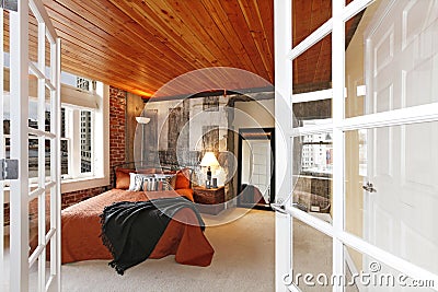 Modern bedroom with a broken concrete wall Stock Photo