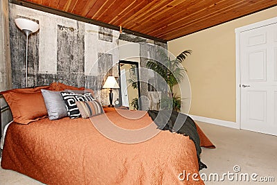 Modern bedroom with a broken concrete wall Stock Photo