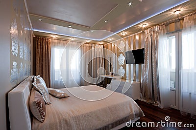 Modern bedroom interior in golden colors Stock Photo