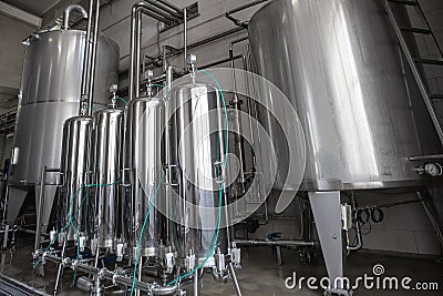 Modern Beer and Beverage Factory. Steel tanks with Liquid Stock Photo