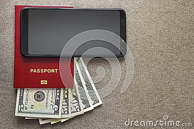 Modern black cellphone, money dollars banknotes bills and passport on copy space background. Travel light, comfortable journey Stock Photo