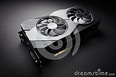 Modern black computer video card on a black background, deep shadows and contrasting light, one object close view, electronic Stock Photo