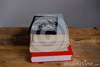 Modern black e-book reader, digital book Kindle, tablet computer device for displaying text electronically on paper books, Editorial Stock Photo