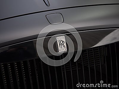 Modern black Rolls Royce Phantom car, front grill / hood and insignia. Editorial Stock Photo
