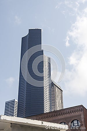 Modern Black Tower Beyond Old Buildings Stock Photo