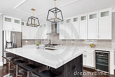 A modern black and white kitchen with the lights off. Editorial Stock Photo