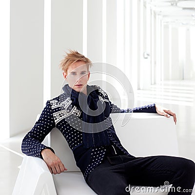 Modern blond male futuristic sci-fi sitting Stock Photo