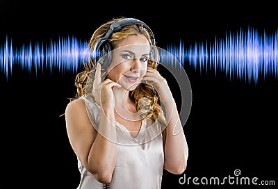 Modern blonde in headphones with sound wave Stock Photo