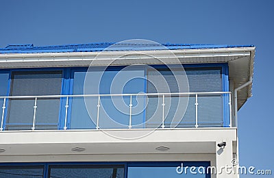 Modern blue house with glass balcony. Contemporary house disign Stock Photo