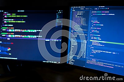 Computer screens with program code Stock Photo